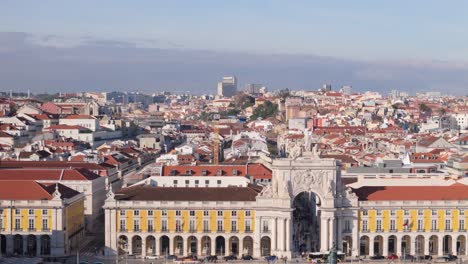 aerial pan across triumphant arch in downtown lisbon portugal city center