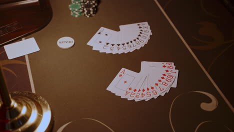 poker table with cards and chips