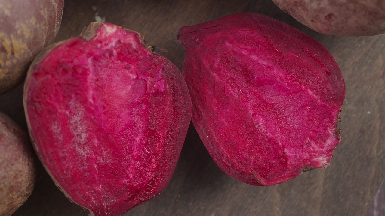 Close-up of Fresh Sliced Beets on a Wooden Background
