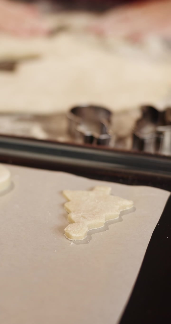 Placing Christmas Tree Shaped Cookie Dough on Baking Sheet
