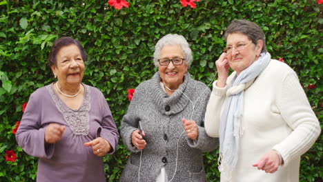 earphones, elderly and funny friends dance to