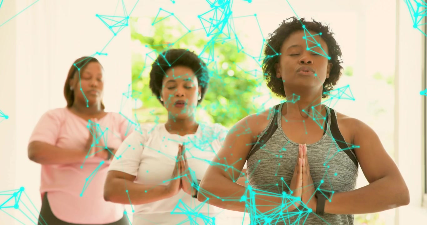 Three women raising hands in yoga space, digital overlay highlighting smartwatches guiding breath