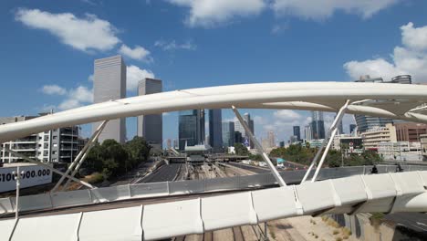 aerial view through the yehudit bridge, in tel aviv, during yom kippur - reverse, drone shot