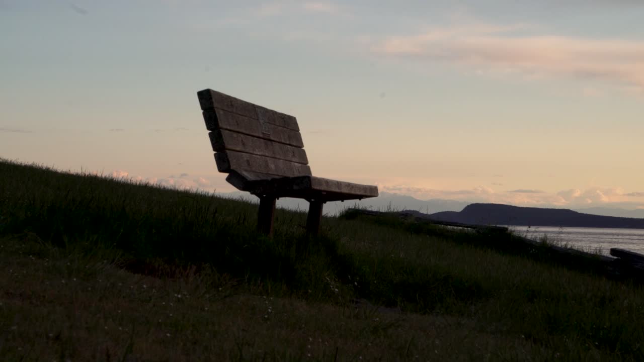Waterfront Wooden Bench In The Early Morning At Washington Park In Anacortes, USA. - wide shot