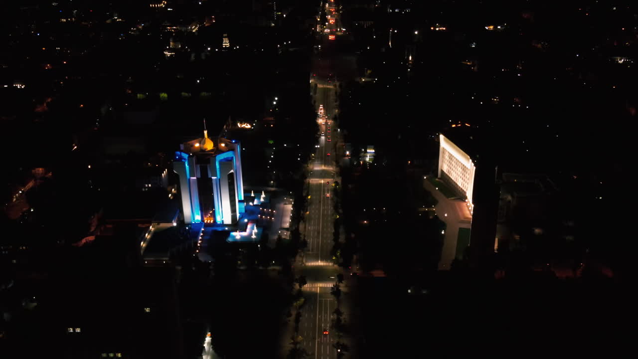 Aerial drone view of Chisinau downtown at night. Parliament, Presidency, road with moving cars and illumination. Moldova