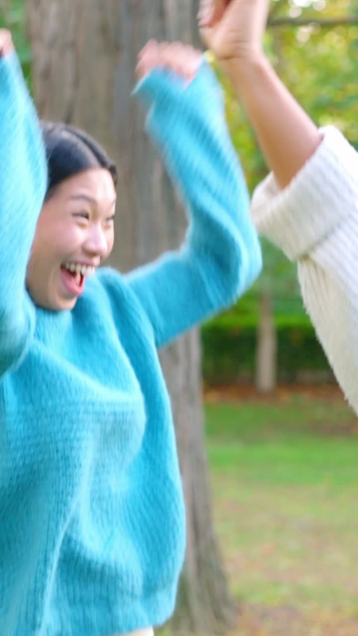 Two friends sharing a warm hug outdoors