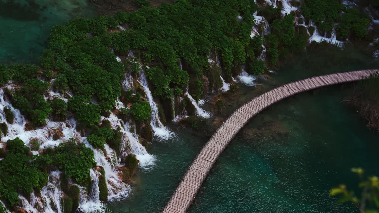 Plitvice Lakes, Croatia. Blue pool, turquoise water. Waterfalls flowing gently at wooden path