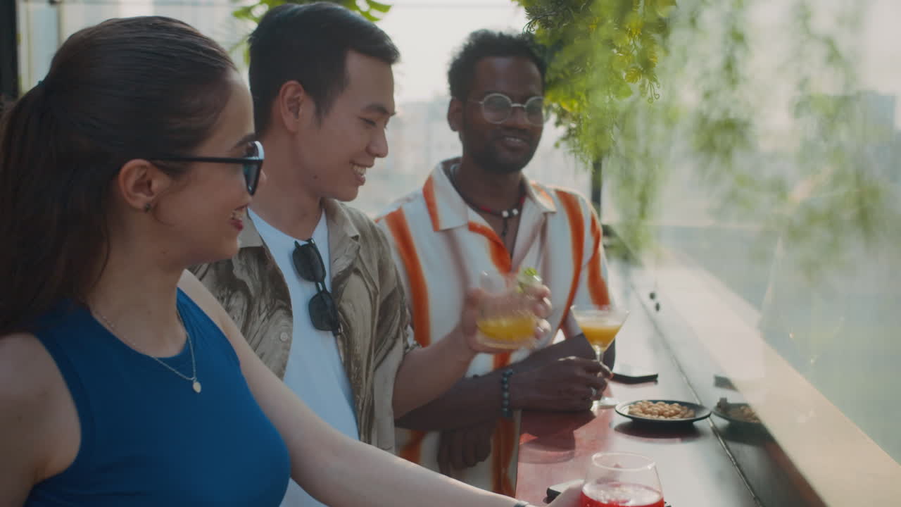 Coworkers Spending Time in Bar with Cocktails and Chatting