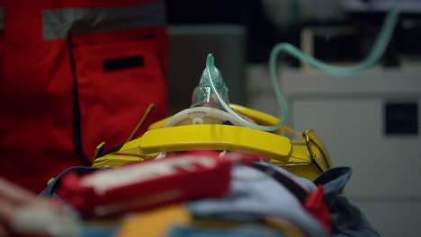 close up view of male patient in oxygen mask lying on stretcher