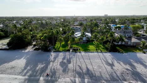 aerial pan of homesites on beachfront in naples florida