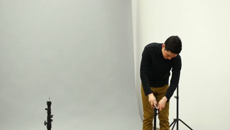 male photographer working in the studio