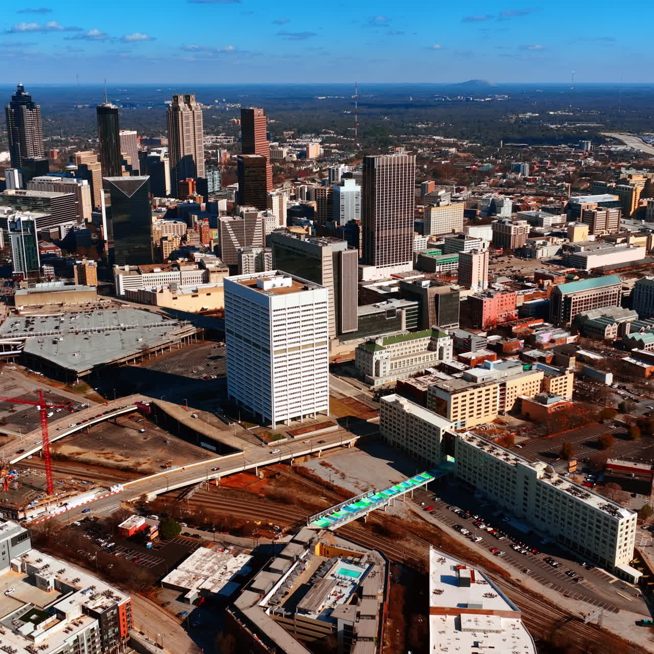 Flying closer to the downtown of Atlanta, Georgia, USA. Several skyscrapers standing out from the urban architecture.