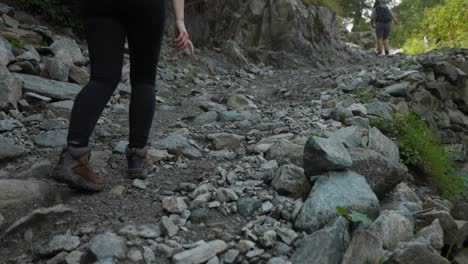 hikers on rough terrain at the mountain hike trails in summer