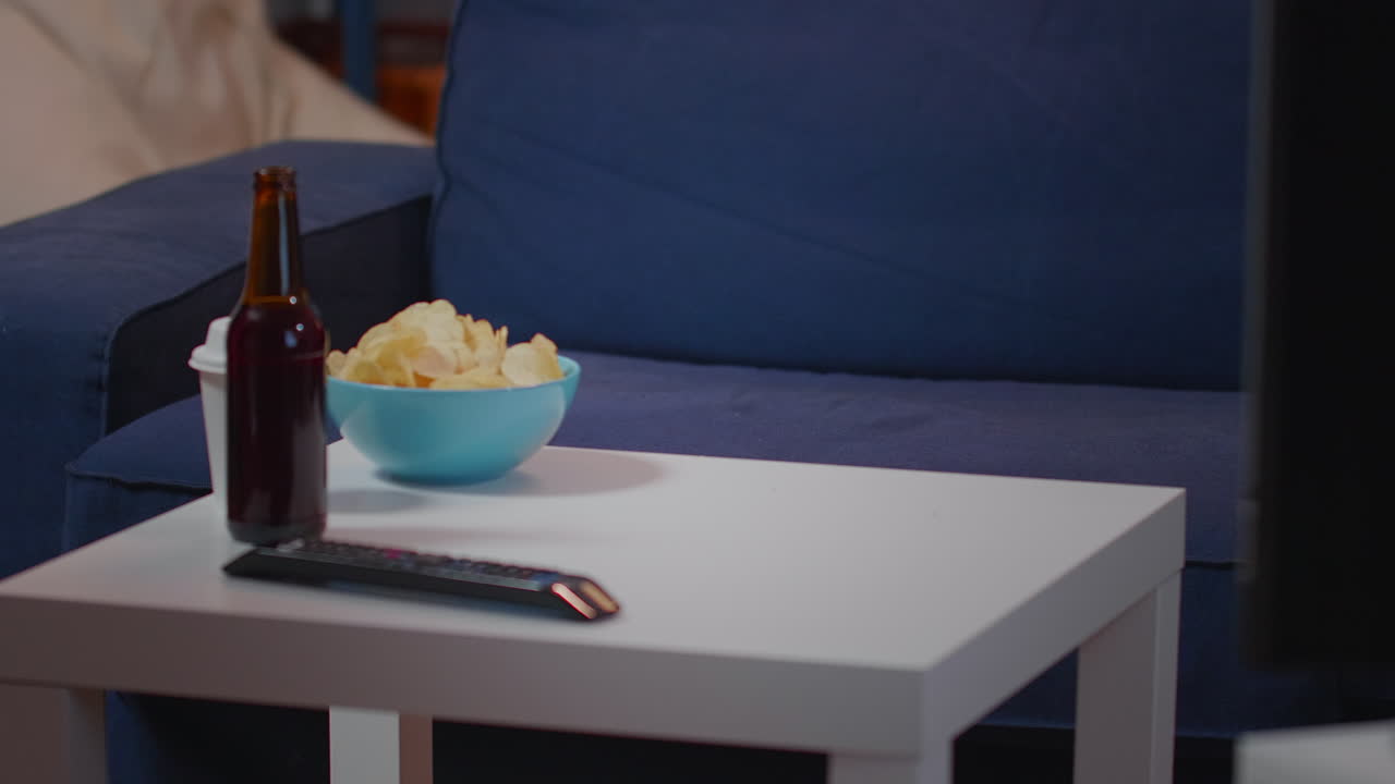 Close up of caucasian person putting box of pizza on table