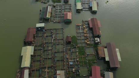 floating fish farming community in bien hoa on the dong nai river, vietnam on a sunny day