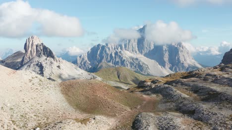 mountain path below alpine peak covered in clouds, monte pelmo mountain, dolomites landscape aerial