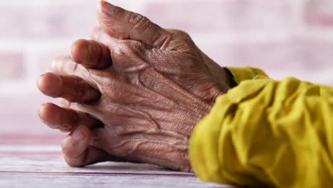 aged hands folded