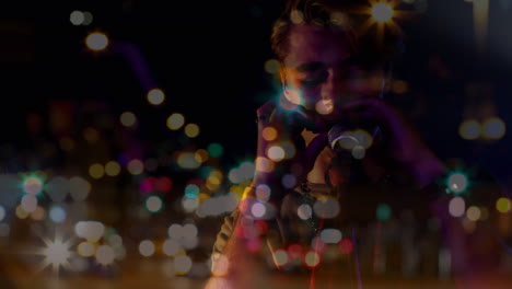 animation of light spots and cars over caucasian singer