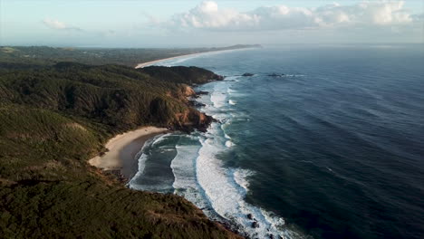 wide-revealing-drone-shot-of-Byron-Bay-Australia-,-ocean-and-landscape