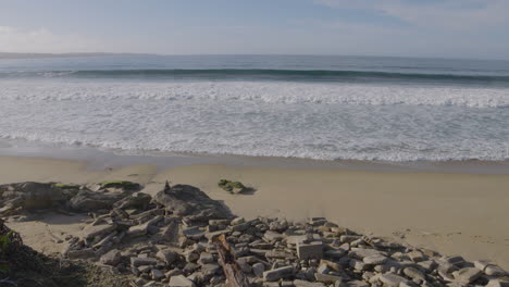 slow motion shot of a sunny day at a deserted beach on the california coast