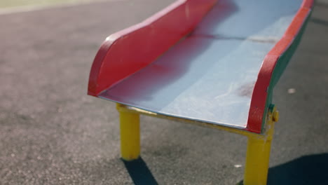 close-up-feet-woman-sliding-on-playground-slide-enjoying-fun-on-summer-vacation-teenage-girl-barefoot-in-school-yard