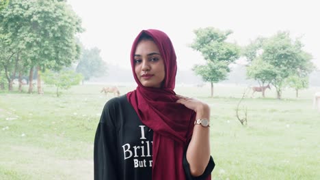 Carefree-woman-in-hijab-posing-in-park-at-outdoor-during-day-time-in-sunny-day
