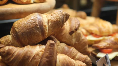 freshly baked croissants in a bakery display