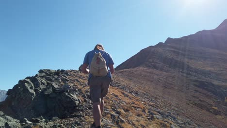 Hiker-close-up-by-cliff-followed-slow-motion-Kananaskis-Alberta-Canada