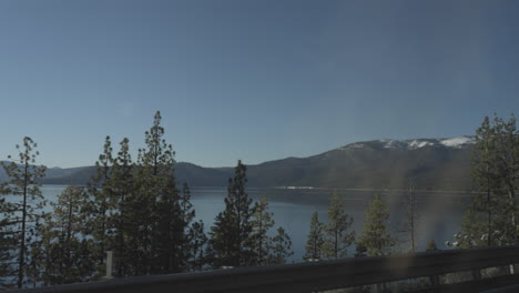 Passenger side view out the window at Lake Tahoe passing by