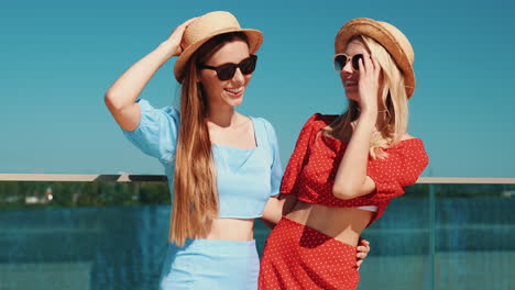 two happy women wearing summer outfits