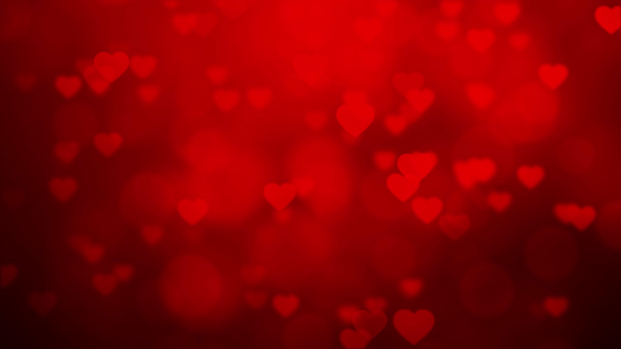 forma de corazón que fluye en un fondo de gradiente rojo con bokeh, video 4k sin costuras