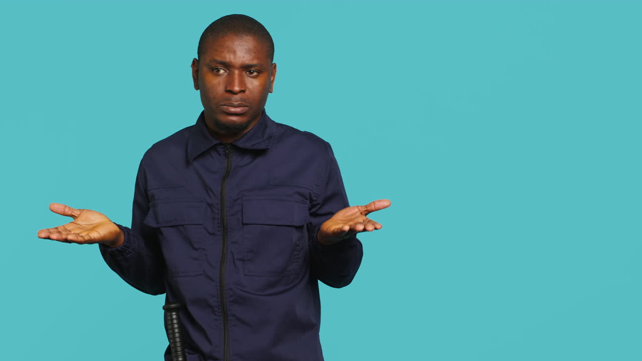 Clueless security guard shrugging shoulders, unable to answer inquiries