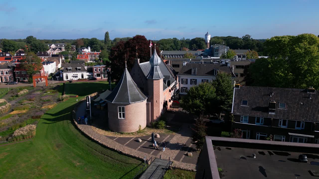 Drone view of Coevorden’s historic castle, showing its rounded towers, red roofs, and surrounding gardens within the urban setting. Location: Coevorden, Drenthe, Netherlands