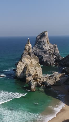 aerial view of the the praia da ursa beach portugal vertical video