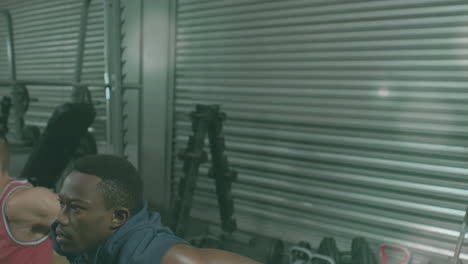 animation of lens flares over multiracial men doing triceps dips on boxes at gym