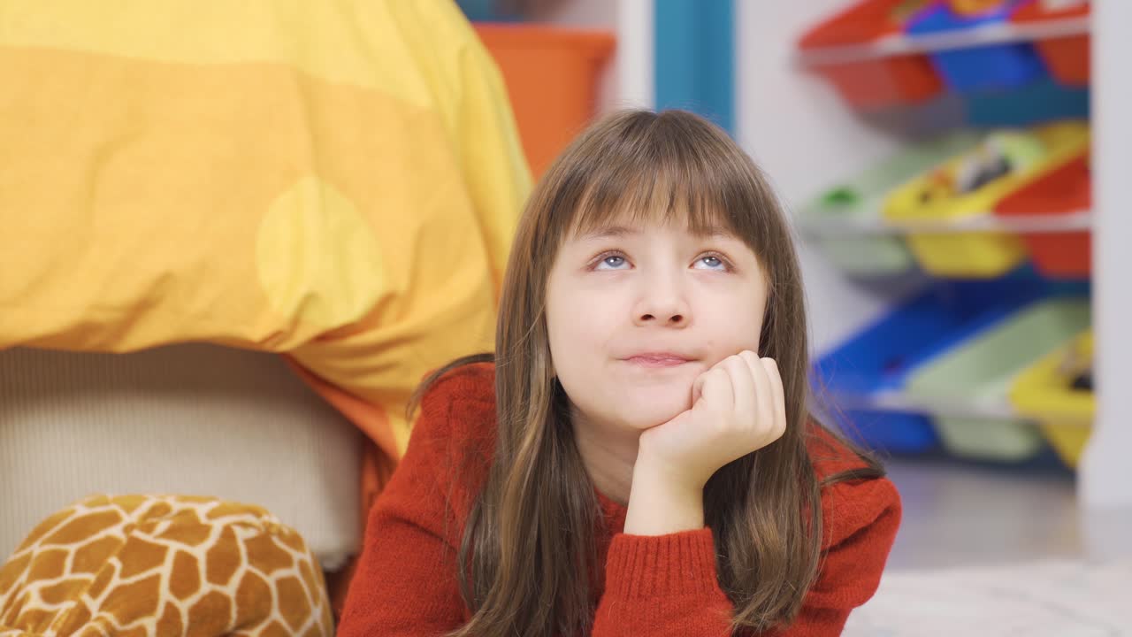 Girl's dream world. Dreaming little girl.