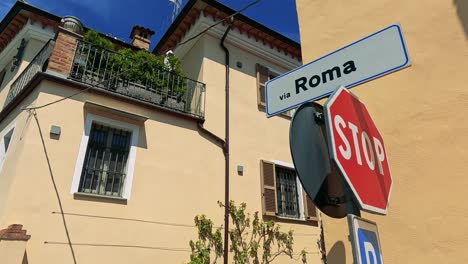 stop sign and street name in italian town