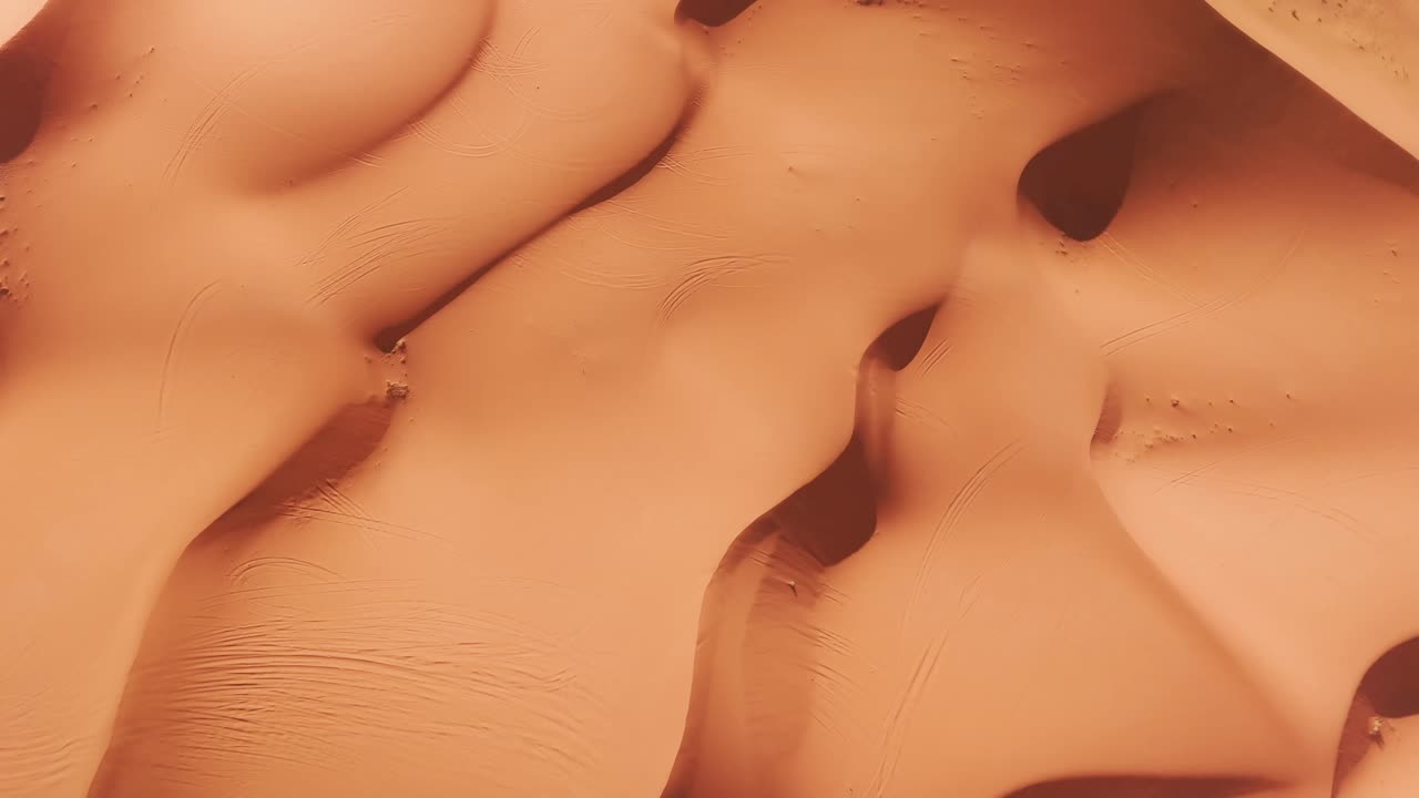 Drone top shot of big sandy dunes in morocco desert
