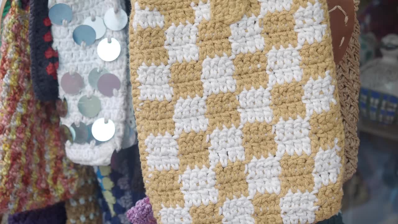 Handmade Crocheted Checkerboard Pattern Bag and Crafts on Display