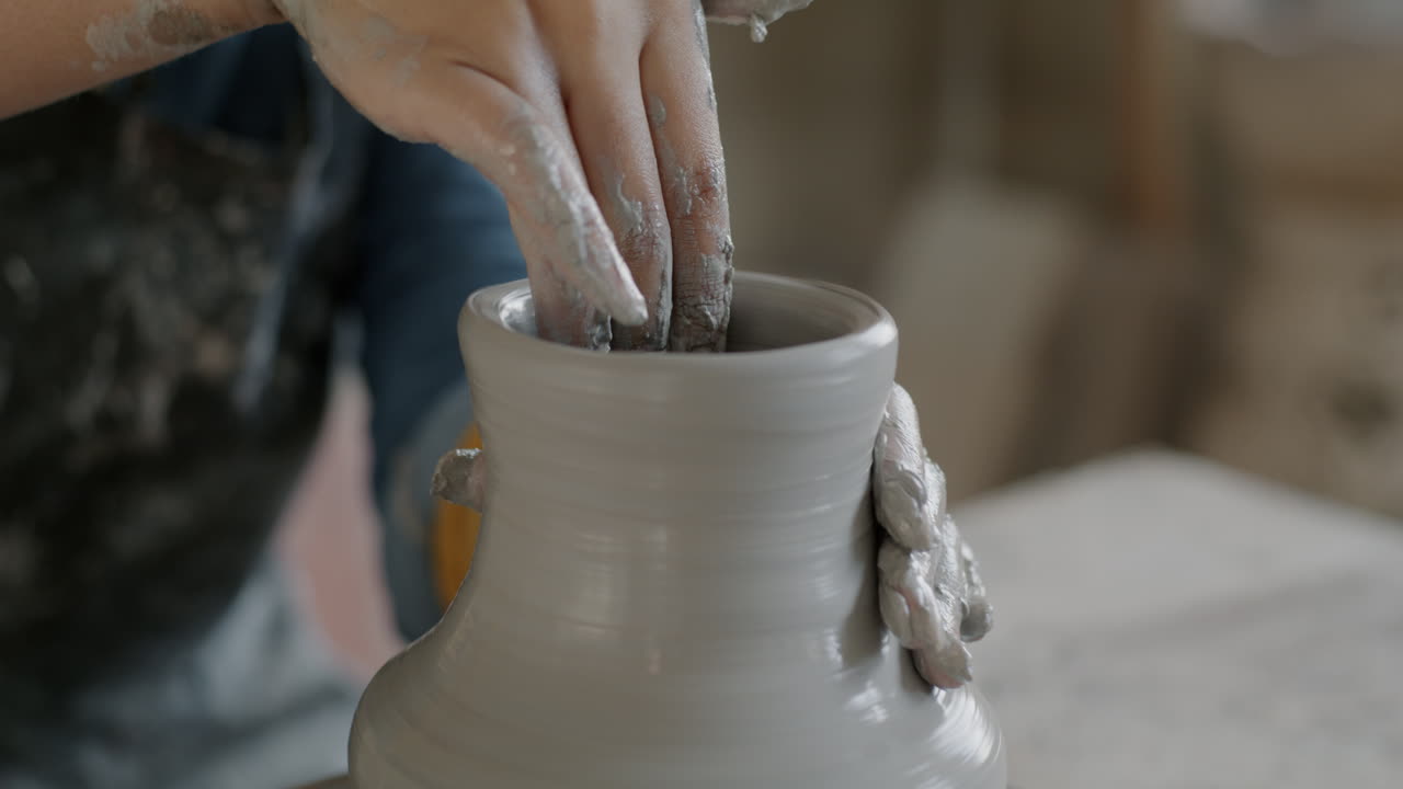 Pottery Artist Shaping a Clay Vase