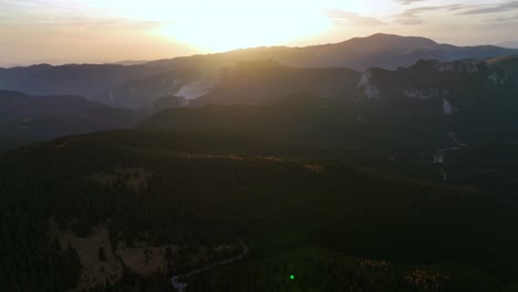 aerial view showing beautiful idyllic mountains of dichiu during golden sunset light,romania