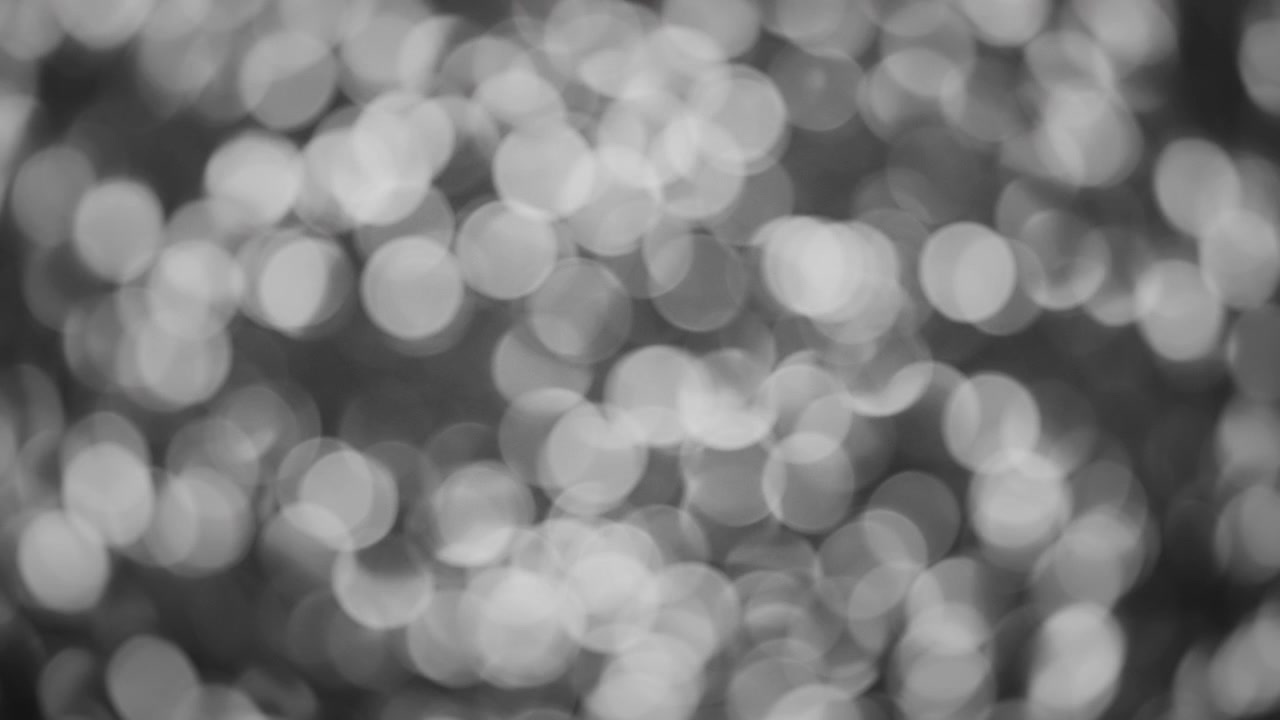 Arrière-plan bokeh abstrait de paillettes blanches scintillantes