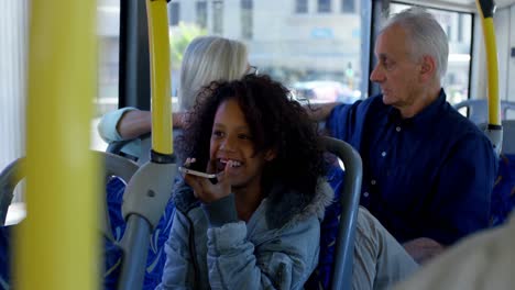 girl talking on mobile phone while travelling in bus 4k