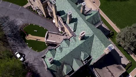 aerial view looking down at historical laurel hall wedding venue mansion rooftop woodland lawn and grounds