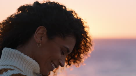 portrait-of-beautiful-hispanic-woman-enjoying-peaceful-seaside-at-sunset-exploring-mindfulness-contemplating-spirituality-with-wind-blowing-hair