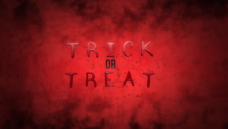 trick or treat on dark red texture with blood