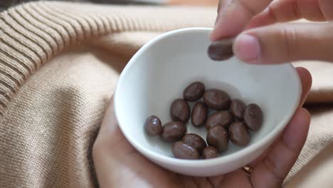 chocolate candies in a white bowl