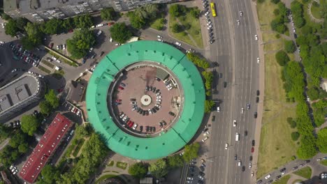 interesting round shape of the building with a green roof