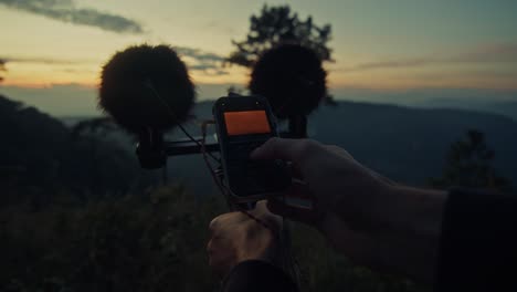sound recording at sunrise in mountains