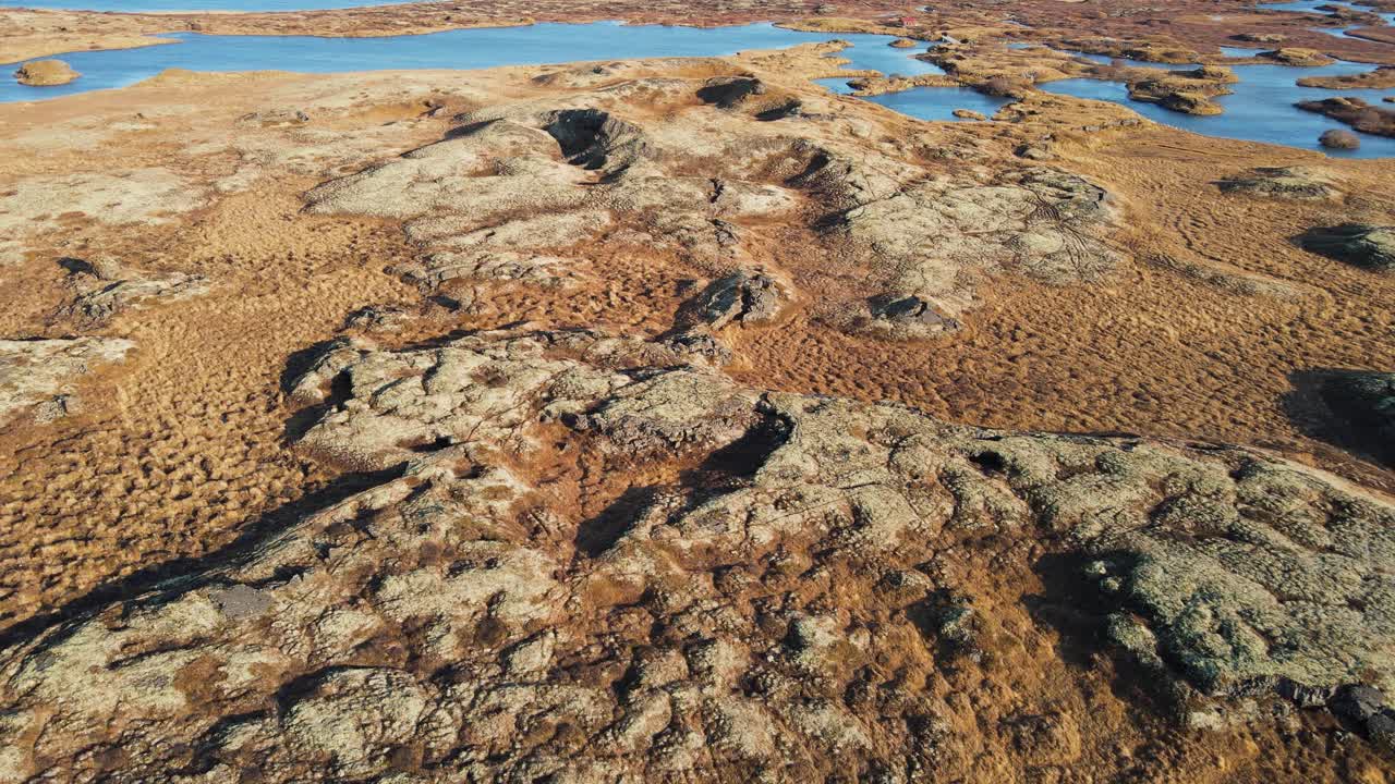 Reveal shot of a huge crater and lake on Iceland
